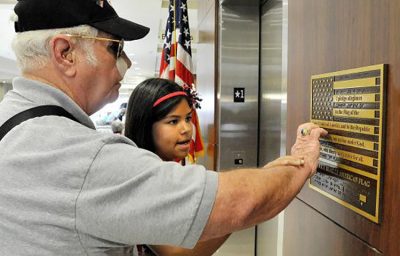 Blind Vet Reading Braille Embossed on Braille Flag