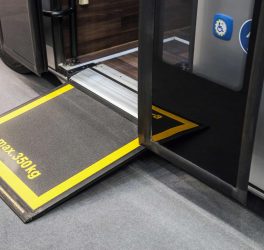 Platform for wheelchairs in the cabin of a modern and comfortable city bus