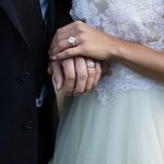 Wedding couple holding hands