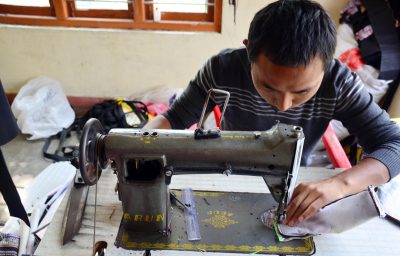 Man sew cotton by Sewing machine