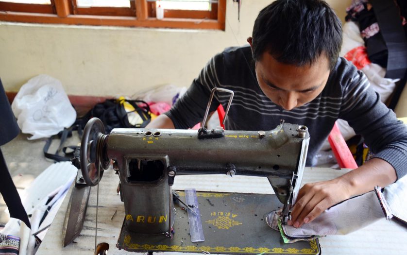 Man sew cotton by Sewing machine
