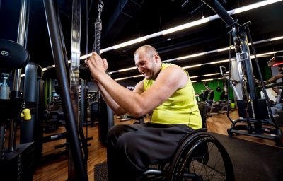 Disabled man training in the gym