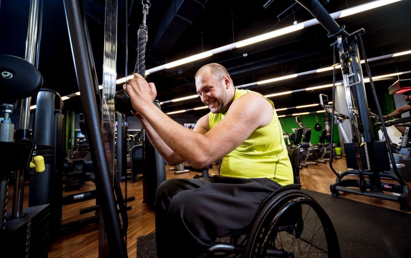Disabled man training in the gym