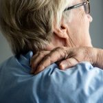 Elderly woman with back pain