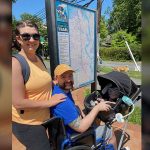 Chelsie and Jeremy King use the WheeStroll Wheelchair Stroller Attachment to take their baby Phoenix on a walk.
