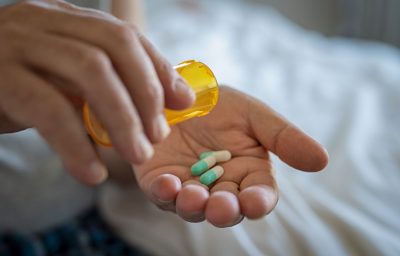 Man hand taking medicine
