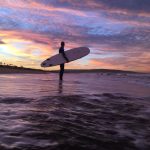 surfing at sunrise
