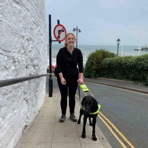 Siobhan Meade outdoor with her Guide dog