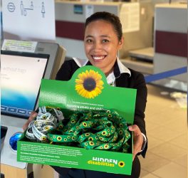 a woman holding the sunflower wearable ID