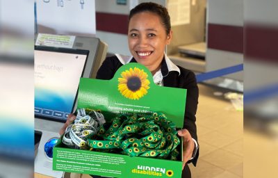 a woman holding the sunflower wearable ID