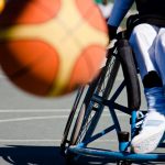basketball player in the wheelchair, motion blur on ball