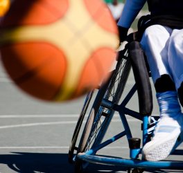 basketball player in the wheelchair, motion blur on ball