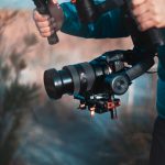 Behind the scenes of movie shooting or video production with camera equipment at outdoor