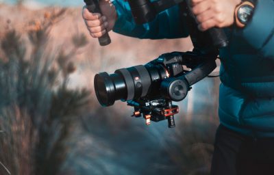 Behind the scenes of movie shooting or video production with camera equipment at outdoor