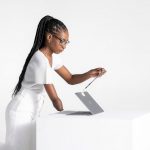 woman with disability opening laptop