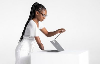 woman with disability opening laptop