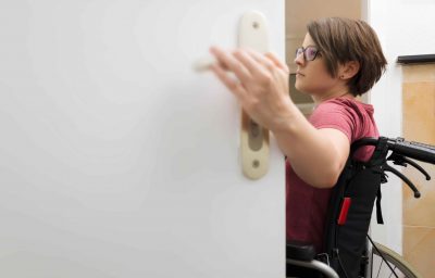 disabled woman at the open door with space