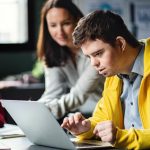 Down syndrome man using computer