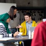Down syndrome man consulting with women