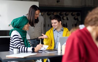 Down syndrome man consulting with women