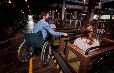 Wheelchair users with family at Disneyland