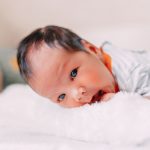 premature newborn baby looking at camera