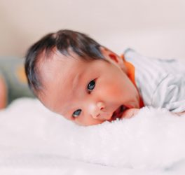 premature newborn baby looking at camera