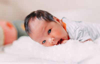 premature newborn baby looking at camera