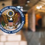 EEOC logo with blur background of office