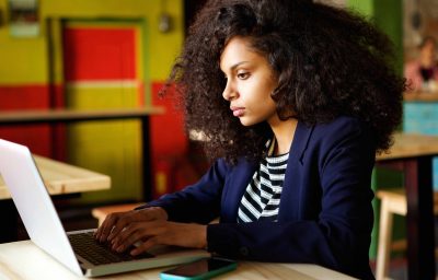 African woman using laptop