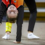 Sara Becarevic warms up before performing a gymnastics routine in Visoko, Bosnia, Wednesday, Dec. 1, 2021.