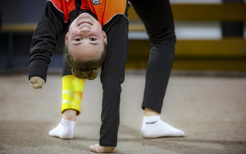 Sara Becarevic warms up before performing a gymnastics routine in Visoko, Bosnia, Wednesday, Dec. 1, 2021.