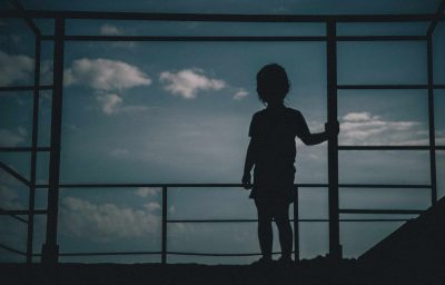 silhouette of kid looking sky