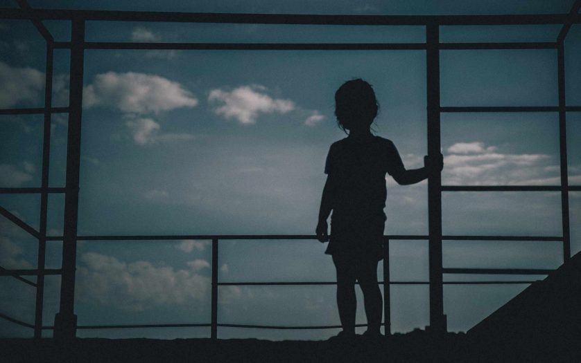 silhouette of kid looking sky