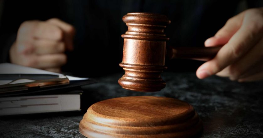 Judge hits hammer, close up