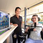 woman in wheelchair with resercher