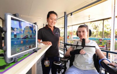 woman in wheelchair with resercher