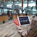 Passenger-using-social-story-tool-during-check-in