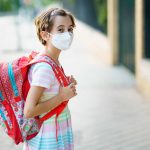 School girl with mask on