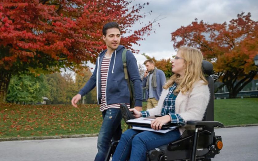 female student in wheelchair with friend