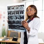 woman doctor watching a patient tomography MRI x-ray
