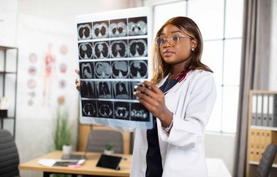 woman doctor watching a patient tomography MRI x-ray
