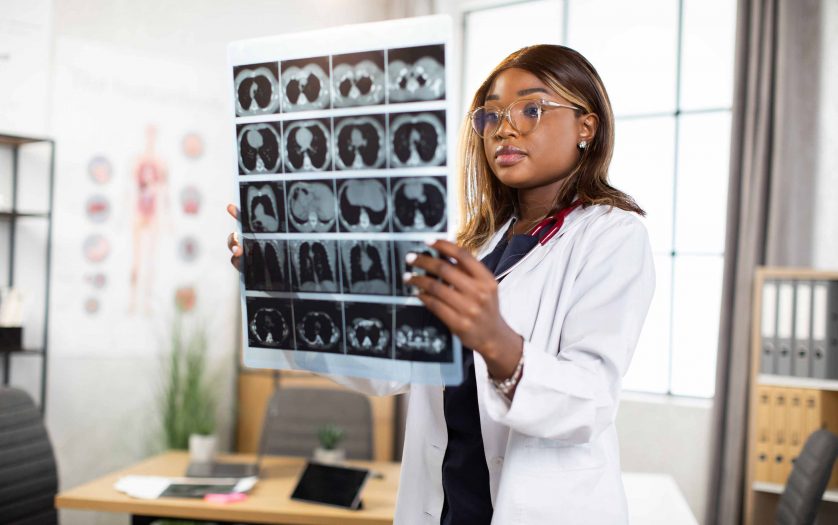 woman doctor watching a patient tomography MRI x-ray