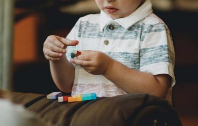 kid holding block toy