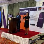 speaker at podium with sign lanuage interpreter