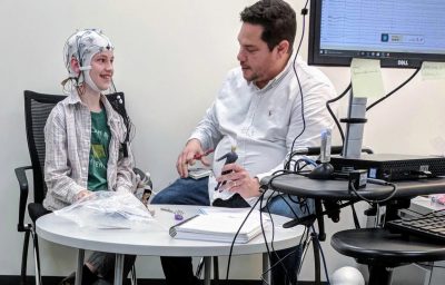 Researchers conducting an electroencephalography study