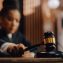 Female judge in a courtroom striking the gavel