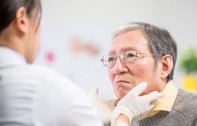 Female doctor check throat