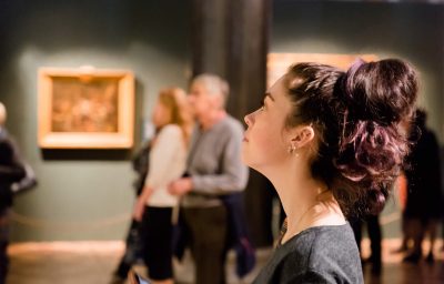 Young women waching arts at the exhibition