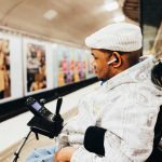 CP man with wheelchair at train station